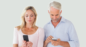 New Roads couple using smartphones