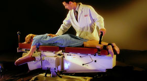 This is a picture of Cox Technic chiropratic spinal manipulation as performed at New Roads Chiropractic Center.